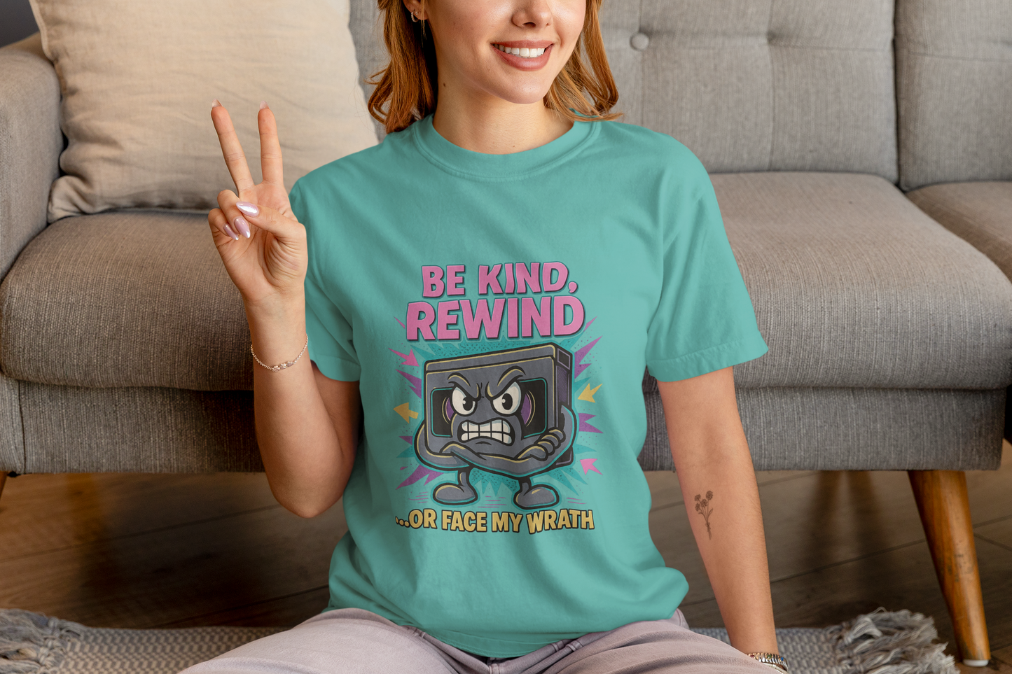 Retro Be Kind Rewind VHS T-Shirt with neon cartoon VHS tape graphic"