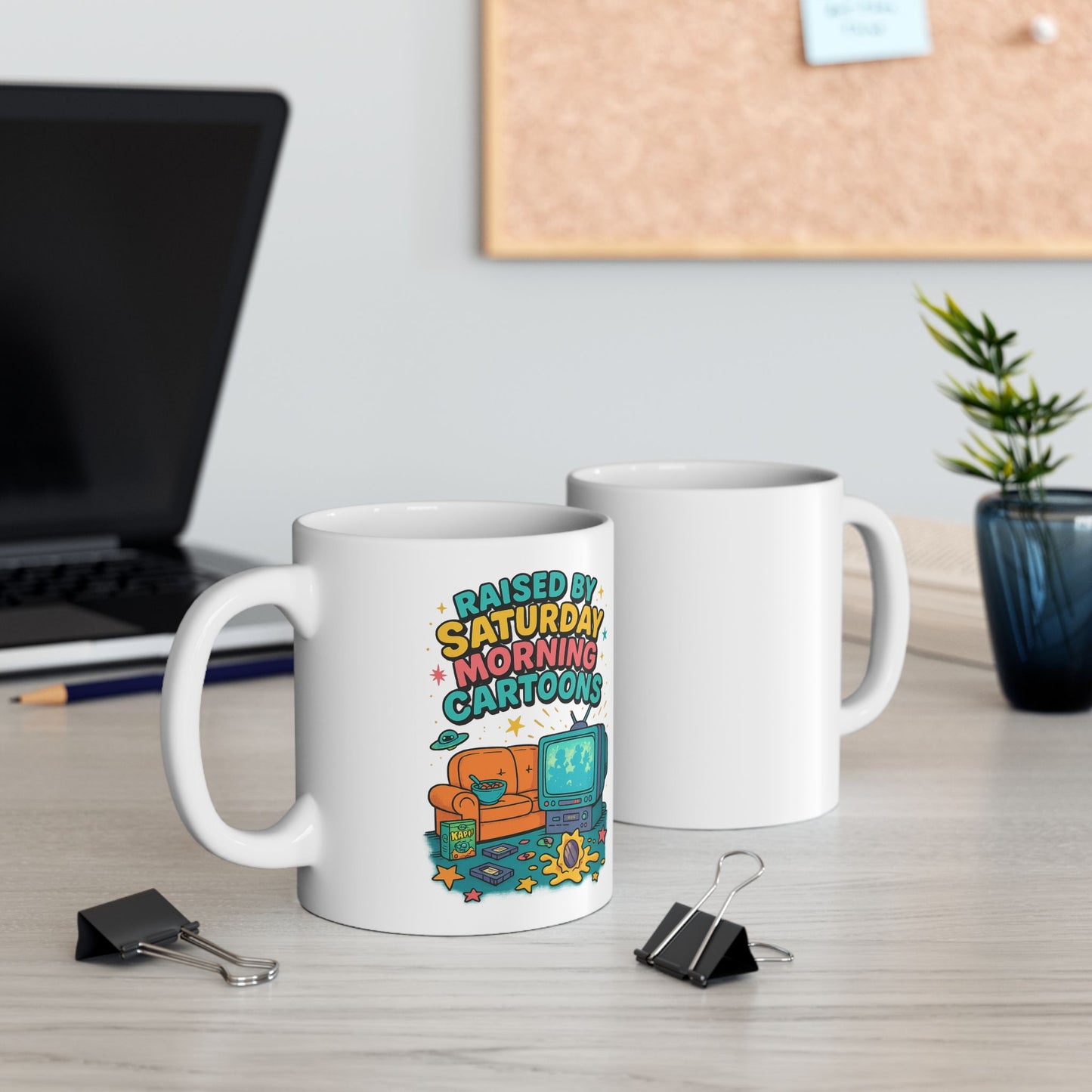 White ceramic mug with retro-style cartoon design featuring a CRT TV, cereal bowl, and couch, 90s nostalgia aesthetic.