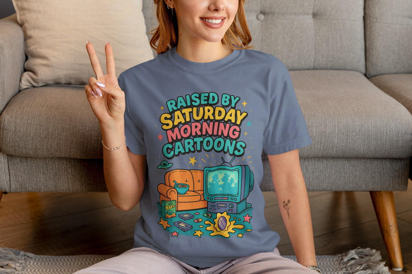 Nostalgic 90s cartoon tee with a couch, cereal bowl & VHS vibes. Perfect gift for retro lovers & Saturday morning warriors. Unisex fit.