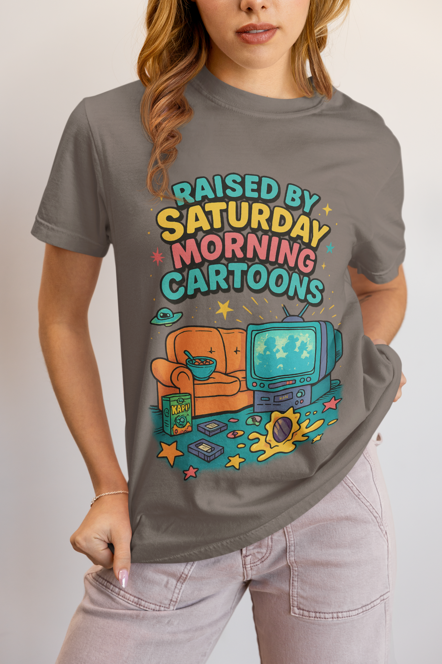 Nostalgic 90s cartoon tee with a couch, cereal bowl & VHS vibes. Perfect gift for retro lovers & Saturday morning warriors. Unisex fit.