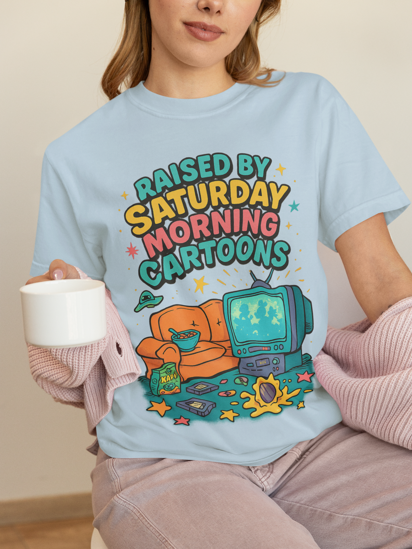 Nostalgic 90s cartoon tee with a couch, cereal bowl & VHS vibes. Perfect gift for retro lovers & Saturday morning warriors. Unisex fit.